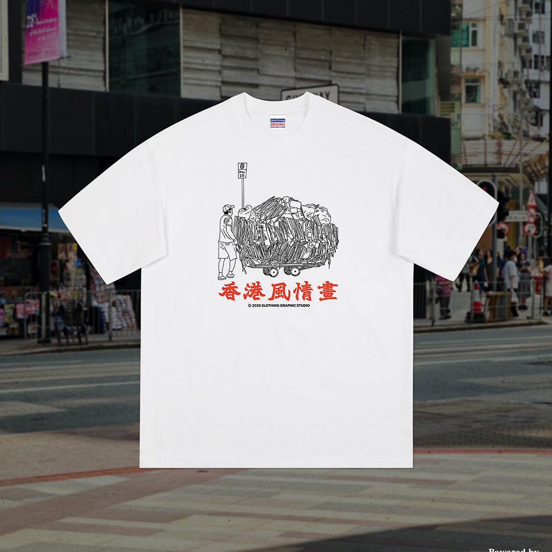 White t-shirt with graphic design and text on a city street background